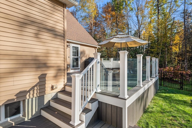 wooden terrace with a lawn