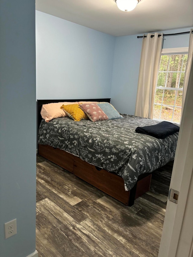 bedroom featuring dark hardwood / wood-style floors