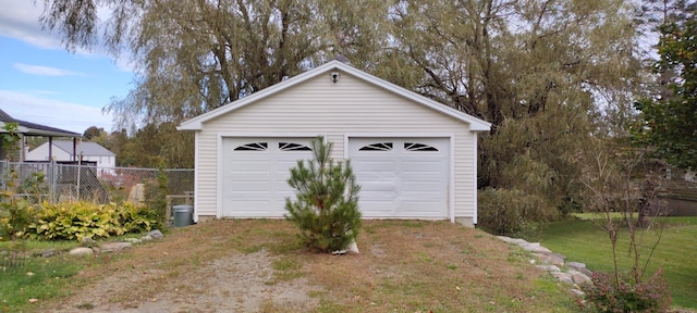 garage featuring a yard