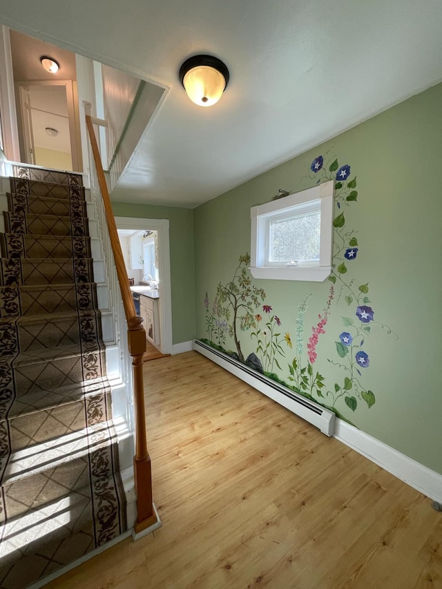 interior space featuring light hardwood / wood-style floors and baseboard heating