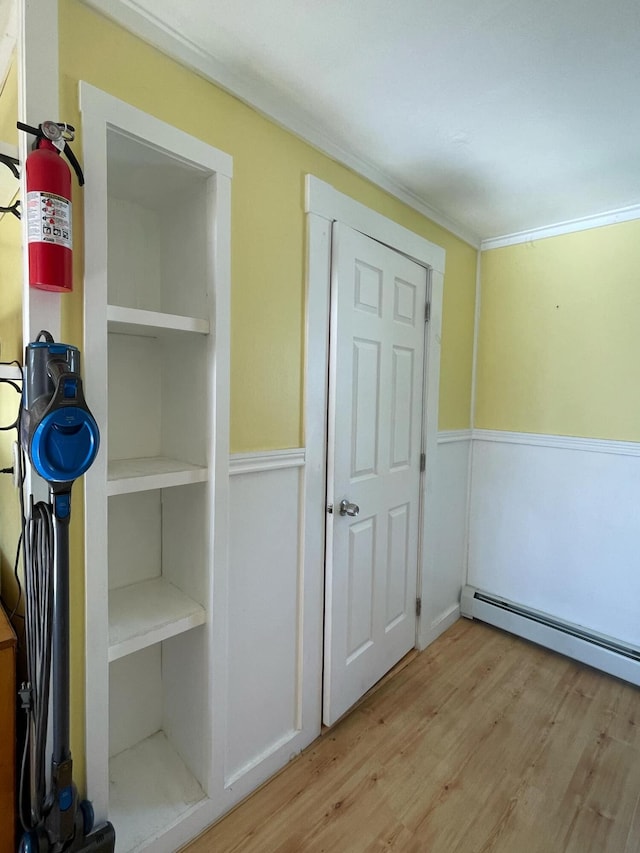 closet featuring a baseboard heating unit