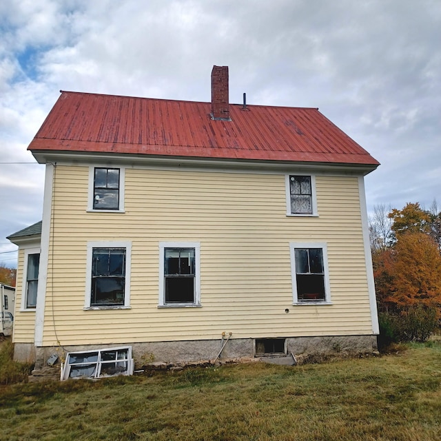 view of property exterior featuring a lawn