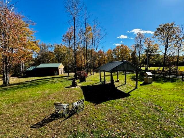 surrounding community with a gazebo and a lawn