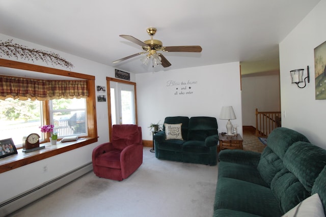 carpeted living room with ceiling fan, a baseboard radiator, and a wealth of natural light