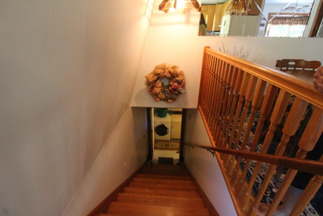 stairway featuring hardwood / wood-style flooring