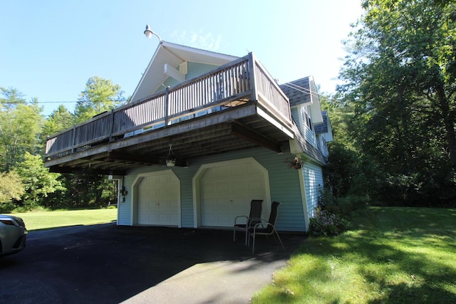 468 Curtis Rd, Swanville, ME 04915 - exterior space featuring a wooden deck, an attached garage, and a lawn