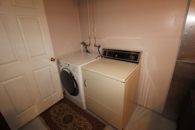 laundry room featuring washing machine and dryer