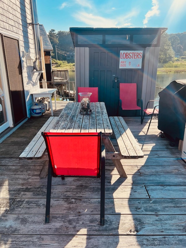 wooden deck with grilling area