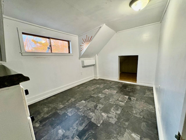 additional living space with lofted ceiling and baseboards