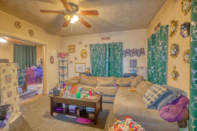 living room featuring ceiling fan, a textured ceiling, and carpet floors