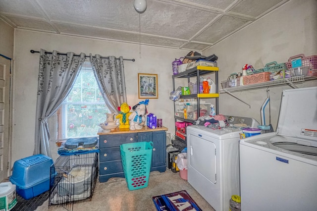 clothes washing area with washer and dryer and light colored carpet