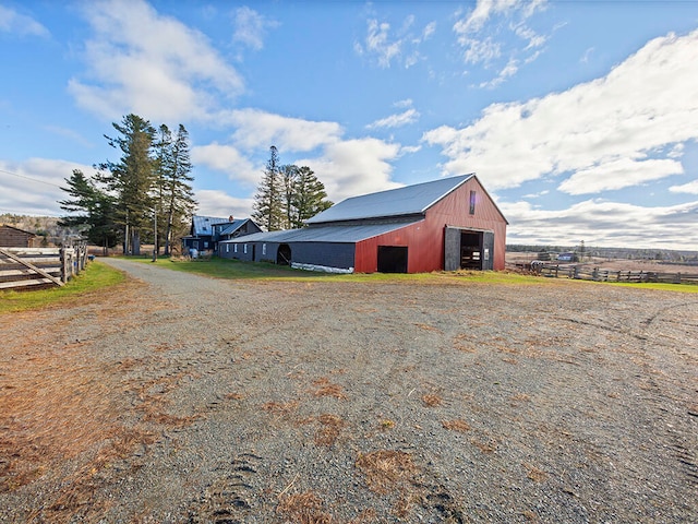 view of outbuilding with a rural view