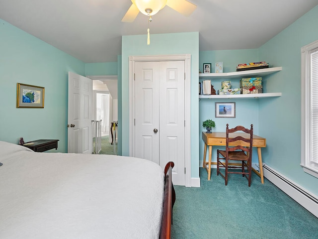 carpeted bedroom with multiple windows, ceiling fan, a closet, and a baseboard radiator