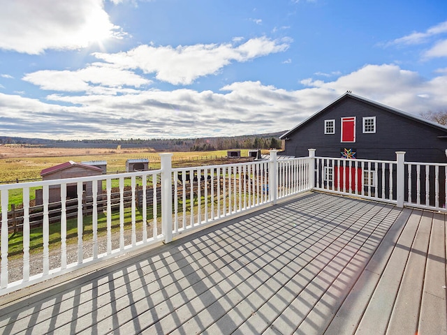 wooden terrace with a rural view