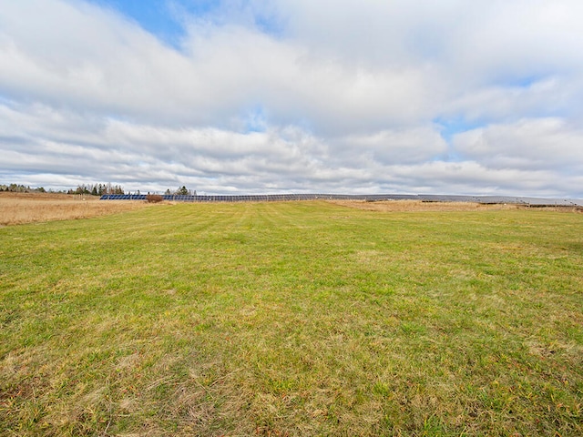 view of yard with a rural view