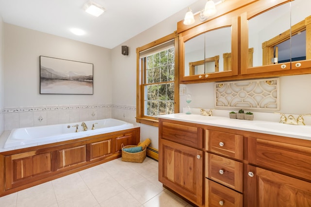 bathroom featuring vanity, a baseboard heating unit, tile patterned flooring, and a bathing tub