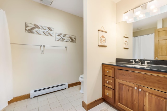 bathroom with toilet, vanity, tile patterned floors, and a baseboard radiator