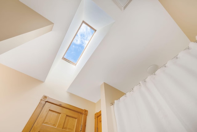 staircase featuring a towering ceiling