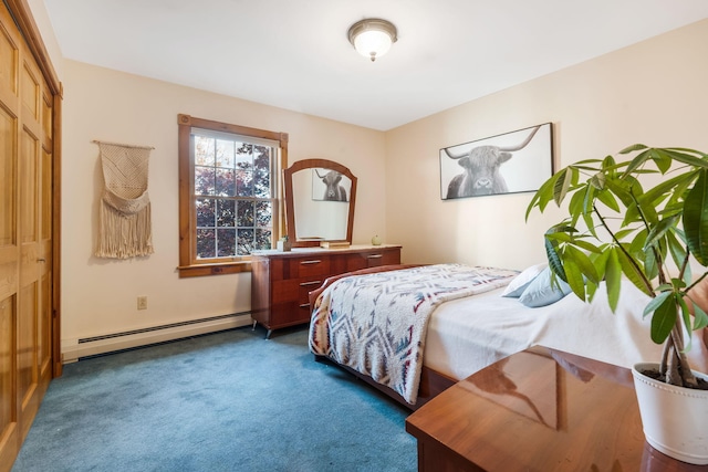 carpeted bedroom with a closet and baseboard heating