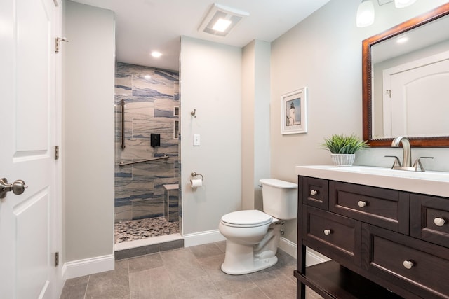 bathroom with toilet, walk in shower, vanity, and tile patterned flooring