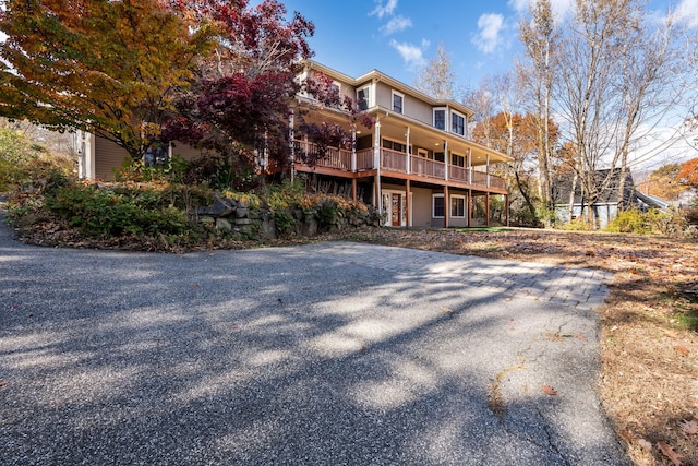 back of property featuring a balcony