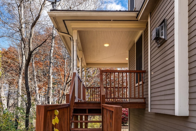 wooden deck featuring cooling unit