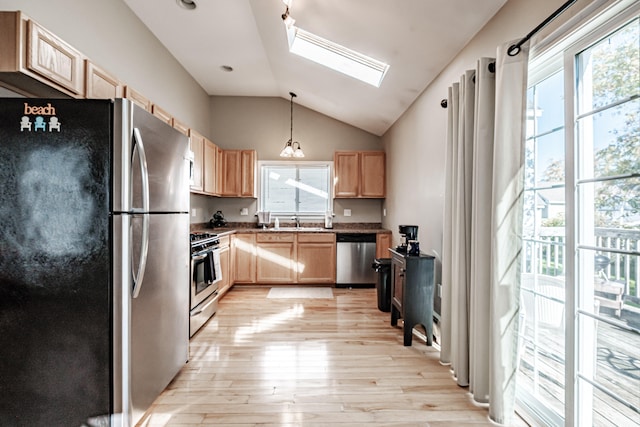 kitchen featuring light brown cabinets, stainless steel appliances, light hardwood / wood-style flooring, and sink