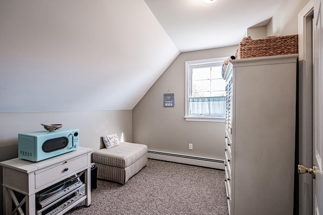 interior space with baseboard heating, light carpet, and vaulted ceiling