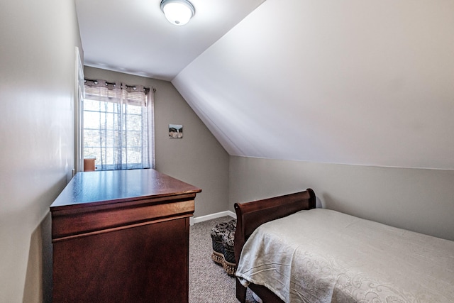 carpeted bedroom featuring lofted ceiling