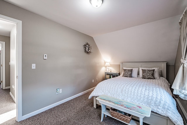 bedroom featuring carpet floors and vaulted ceiling