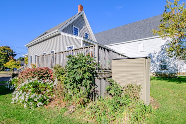 view of home's exterior featuring a lawn