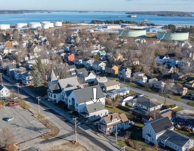 birds eye view of property featuring a water view