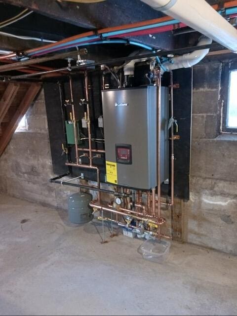 utility room featuring water heater