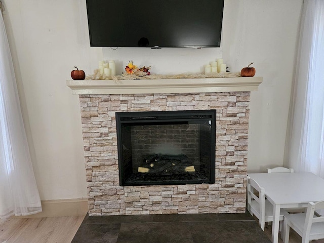 interior details featuring a fireplace and hardwood / wood-style floors