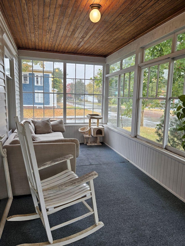 sunroom featuring wooden ceiling