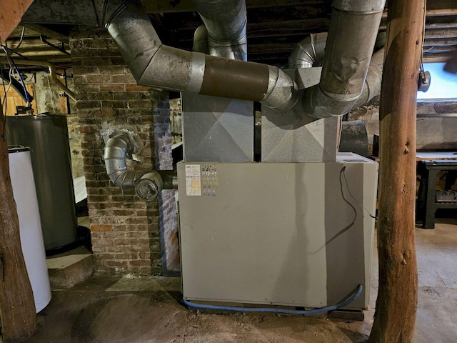 utility room with heating unit and water heater