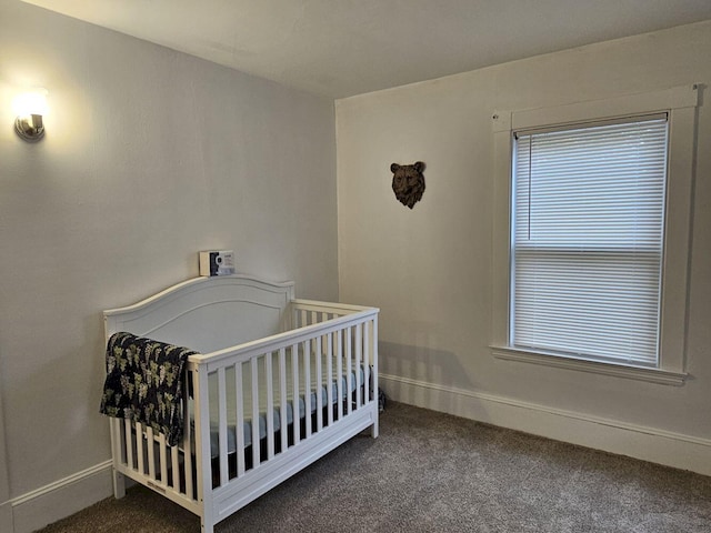 carpeted bedroom with a nursery area