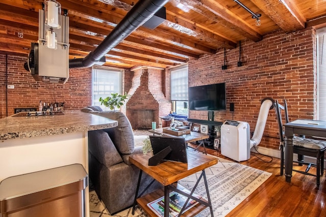 living room featuring brick wall, beam ceiling, wooden ceiling, and dark wood-type flooring