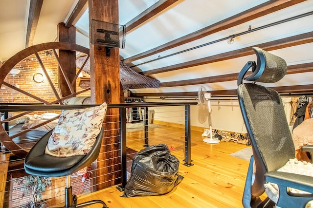 interior space with beamed ceiling and wood-type flooring