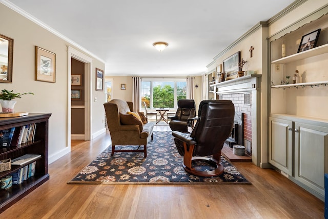 interior space with ornamental molding, a brick fireplace, and wood-type flooring