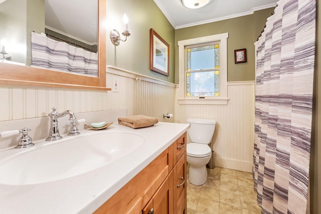 bathroom featuring vanity, crown molding, toilet, and tile patterned flooring