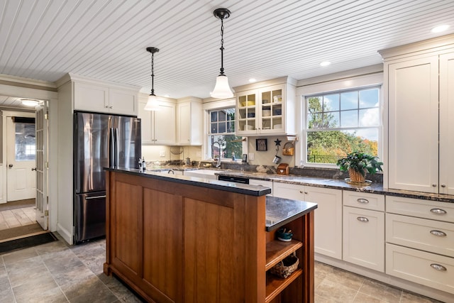 kitchen featuring stainless steel fridge, wood ceiling, decorative light fixtures, and a kitchen island