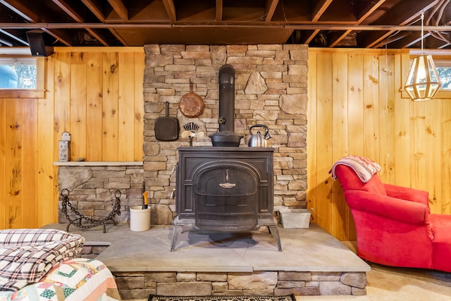 details with a wood stove and wood walls