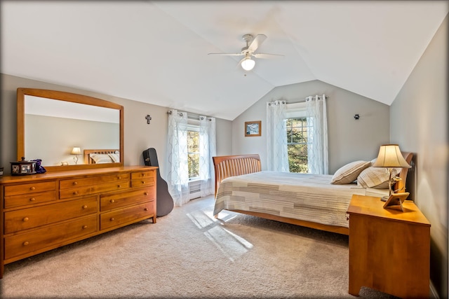 bedroom featuring baseboard heating, vaulted ceiling, carpet floors, and ceiling fan