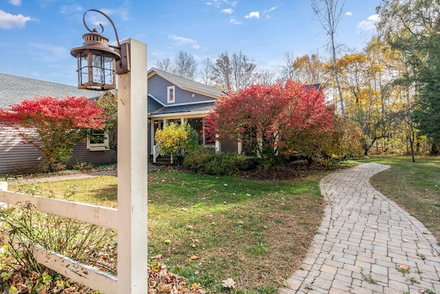 view of home's exterior with a yard