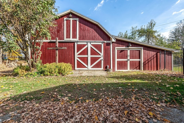 view of outbuilding featuring a lawn