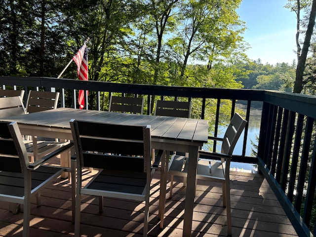 wooden terrace with a water view