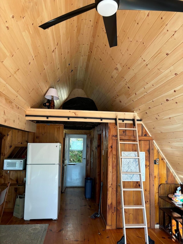 additional living space featuring wood ceiling, wooden walls, dark wood-type flooring, and vaulted ceiling