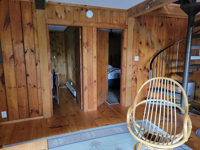 interior space with wood walls and wood-type flooring