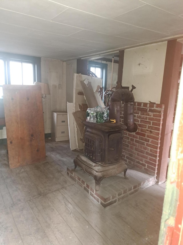 interior space featuring hardwood / wood-style floors and a wood stove